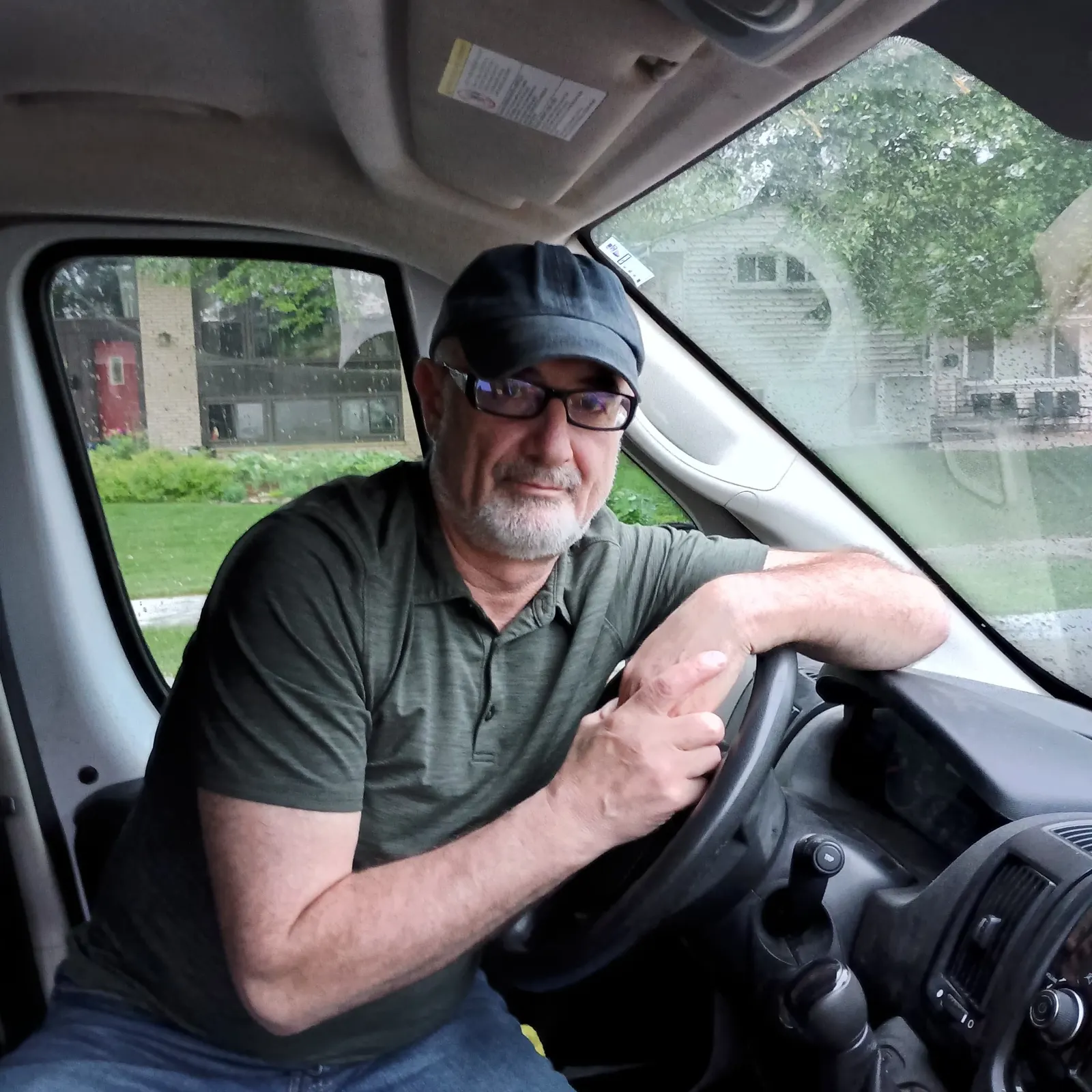 Professional Continent Logistics driver behind the wheel of a RAM ProMaster 3500 cargo van — interstate freight across the USA