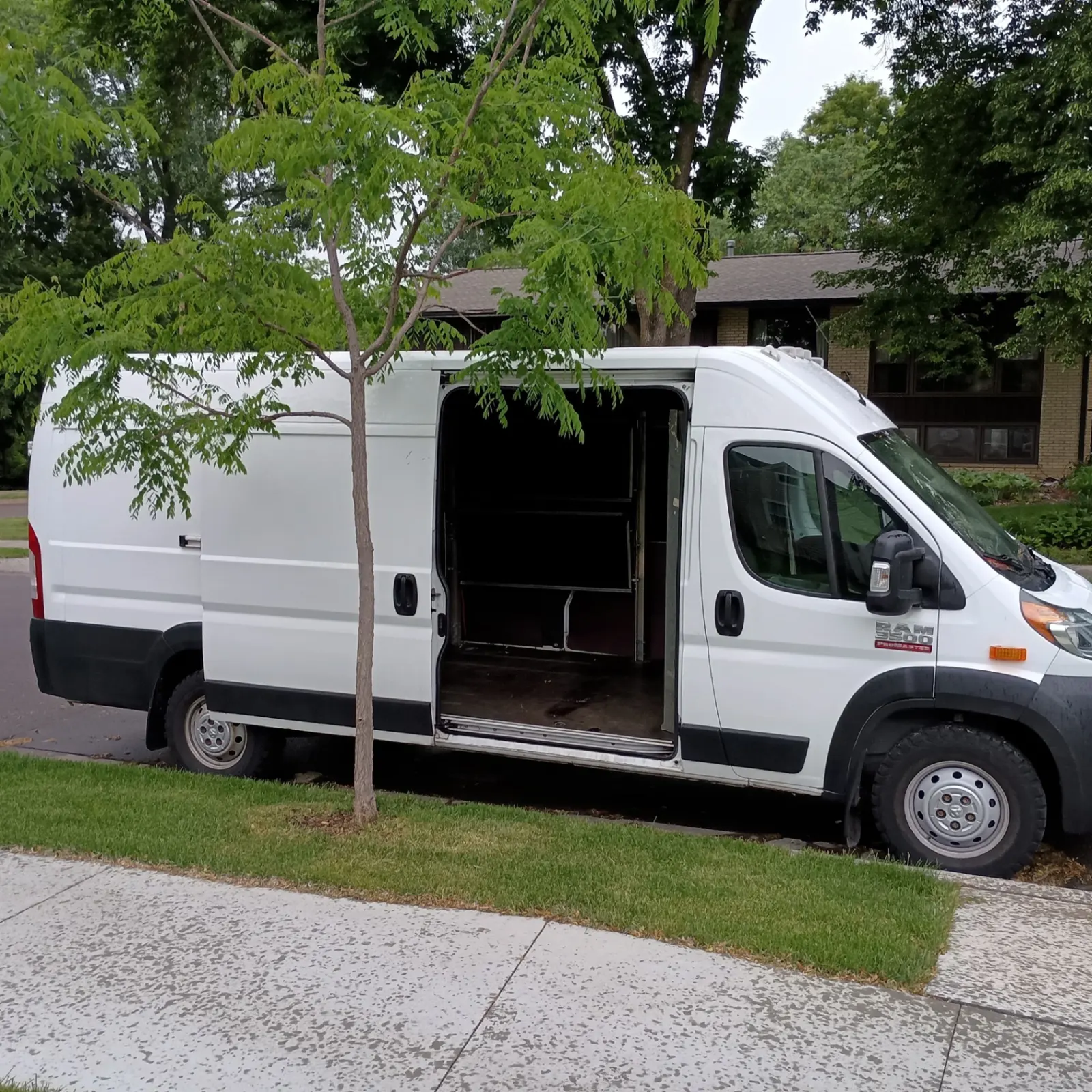 Open sliding side door of a cargo van — loading 48x40 pallets
