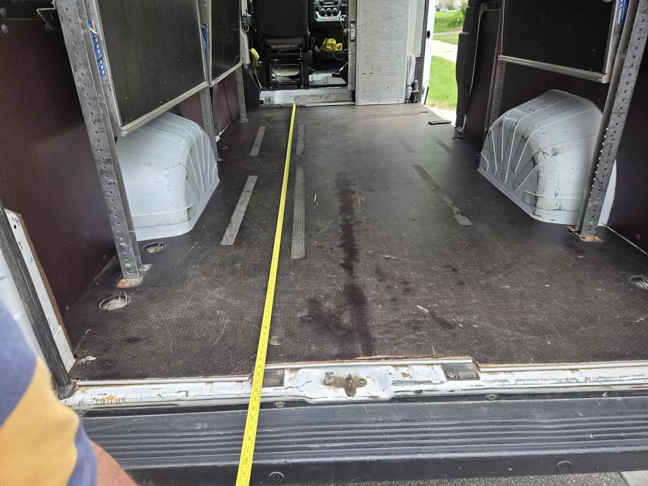 Tape measure stretched along the full cargo floor length